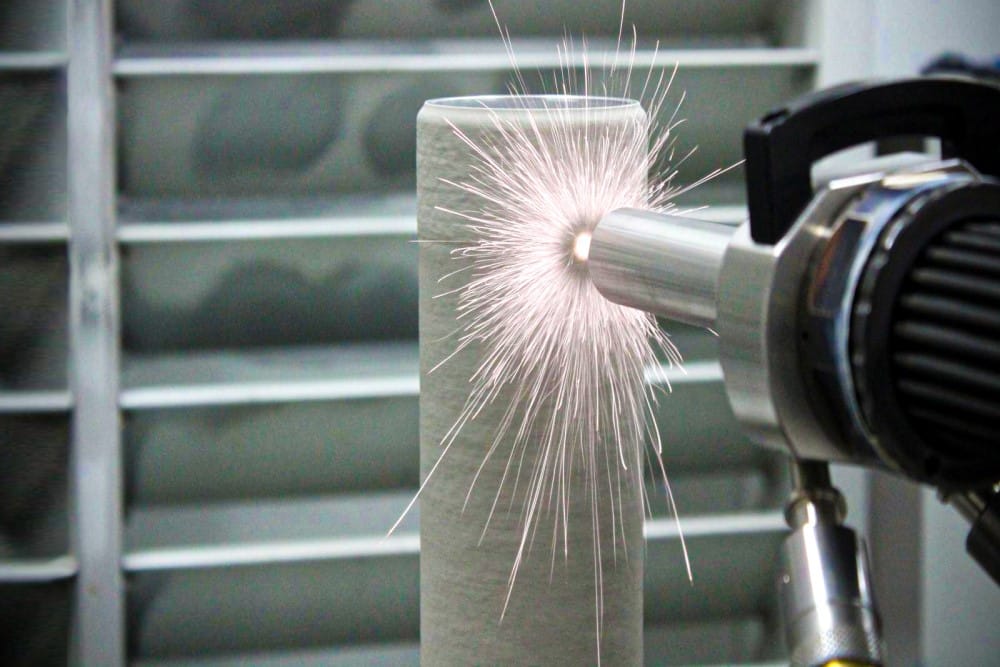 Photo of the cold spray process in action